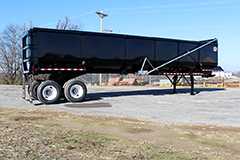 Side view of a Clement ScrapStar Scrap trailer parked in a lot